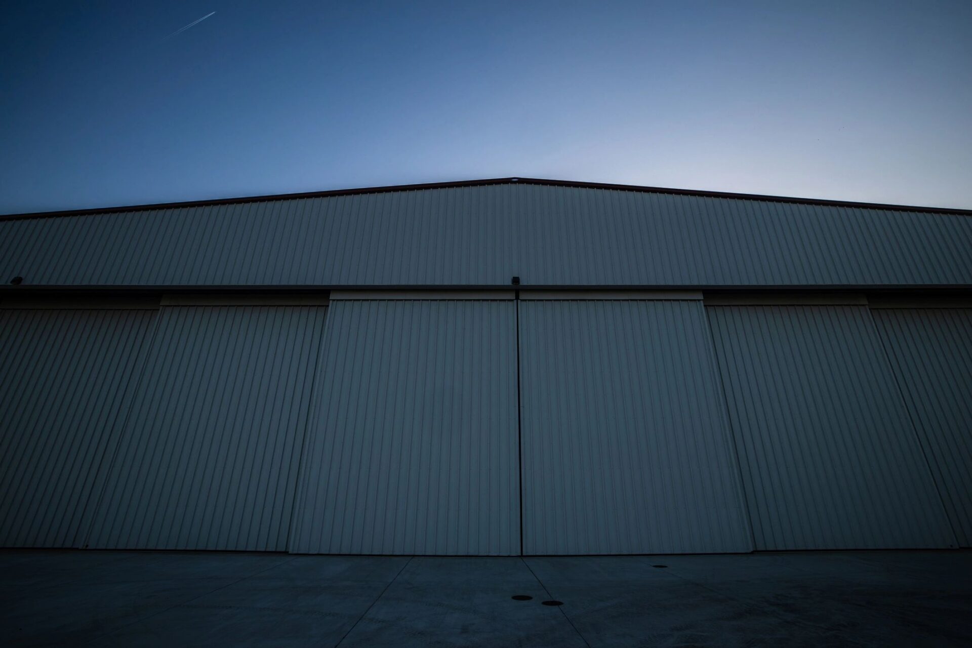 Large-scale roof structure representing major reroof logistics